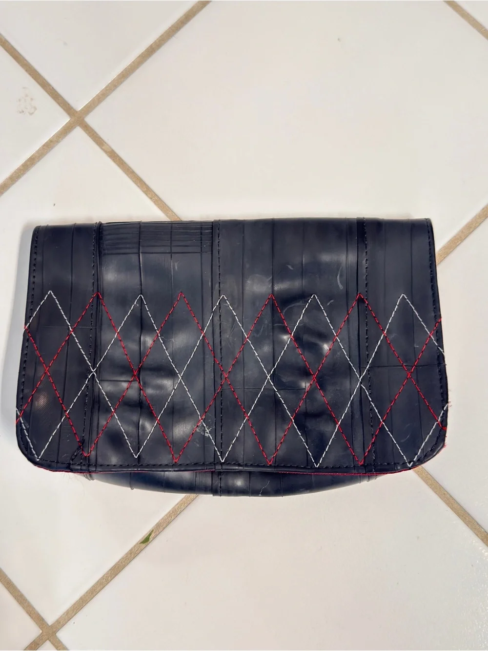 Recycled tire Broadway clutch with burgundy interior